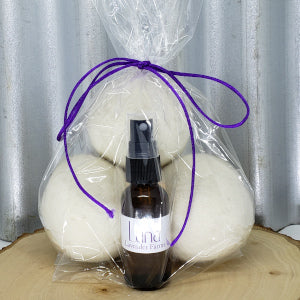 3 new Zealand wool organic wool balls in a clear bag with a 30ml spray bottle of organic lavender oil